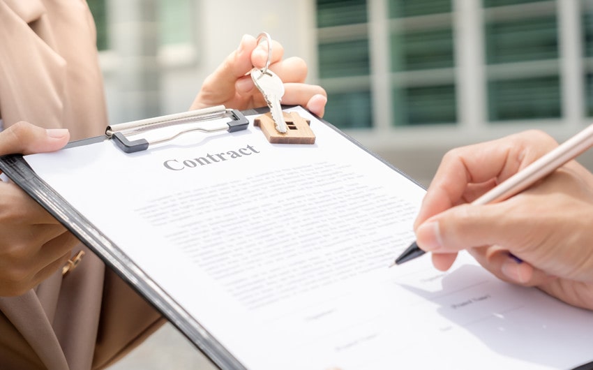 Landlord holding a rental contract